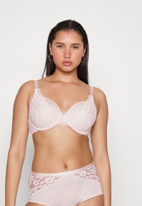 Light pink lace bra with molded cups, adjustable straps, and decorative lace trim; matching lace-accents hipster briefs.