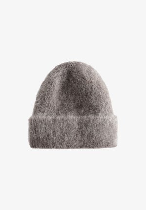 Gray knitted beanie made of soft, fluffy material. Features a turned-up cuff and a rounded top for a snug fit.