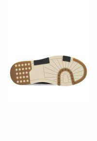 Suela de zapato con una base beige, acentos negros y texturas variadas; presenta agarres circulares, un diseño estampado y una sección de talón redondeada.