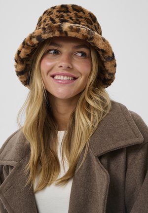 Chapeau seau à imprimé léopard en tissu doux et pelucheux, doté d'un large bord et d'une palette de couleurs chaude alliant marron et noir.