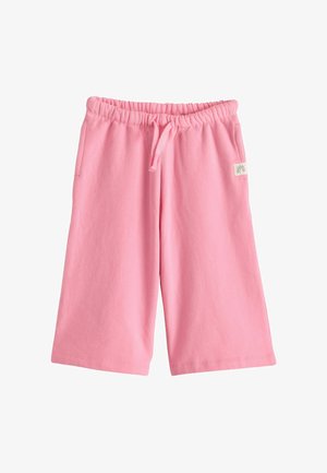 Pink knælange shorts med elastik i taljen, snørre, sidelommer og en lille regnbueapplikation på højre side.