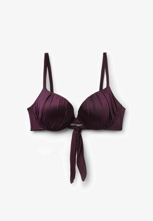 Sujeción acolchada de color púrpura oscuro con tirantes delgados ajustables y detalle de nudo delantero, presentada sobre un fondo blanco.