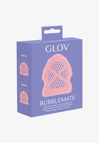Cuscinetto per il corpo in silicone rosa con superfici testurizzate per l'esfoliazione. Il packaging presenta uno sfondo viola con dettagli del prodotto in testo bianco.