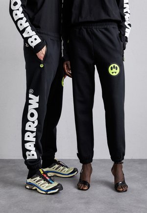UNISEX - Tracksuit bottoms - nero/black