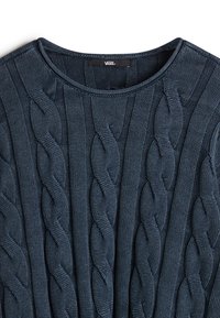 Navy blue knitted sweater with a textured cable knit pattern, featuring a round neckline and ribbed trim. Brand label visible at the neck.