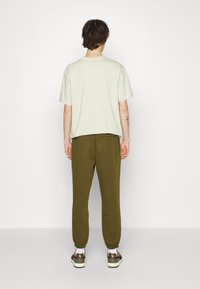 Puma Jogginghose - gruen
