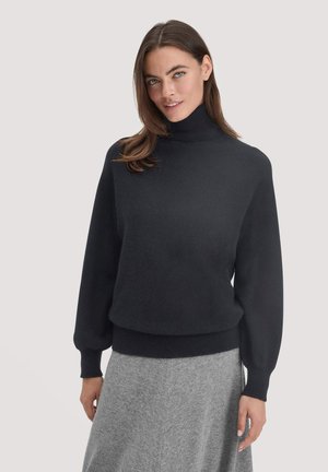 Zwarte coltrui met lange pofmouwen en geribbelde tailleband, gemaakt van een zachte stof; minimalistisch ontwerp, geen patronen of accenten.