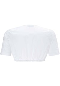White cropped T-shirt with short sleeves, elasticized bottom hem, and breathable fabric. Features lace accents on shoulders.