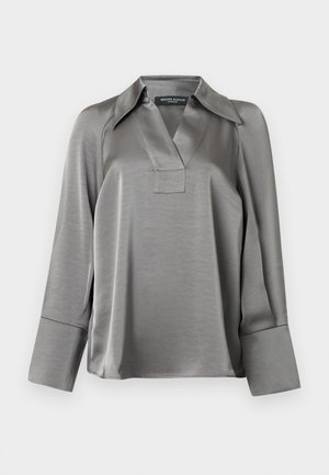 Silver satin blouse with a pointed collar, V-neckline, and long sleeves featuring wide cuffs. Smooth texture with a slight sheen.