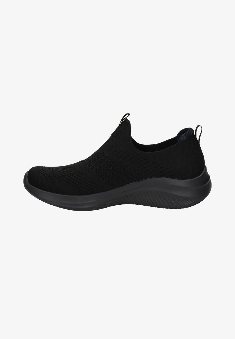 Baskets noires sans lacets avec empeigne en maille, semelle texturée et languettes sur la languette et le talon pour un enfilage facile.