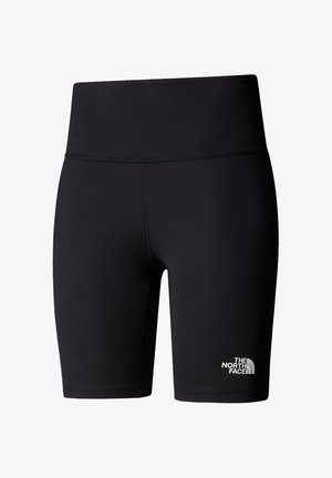 Pantalones cortos de ciclismo negros hechos de material elástico con una cintura alta, que cuentan con un logo blanco en la parte inferior de la pierna izquierda. Textura suave.