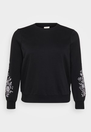 Black sweatshirt with long sleeves, ribbed crew neck, and floral white embroidery on the sleeves. Soft fabric with a relaxed fit.