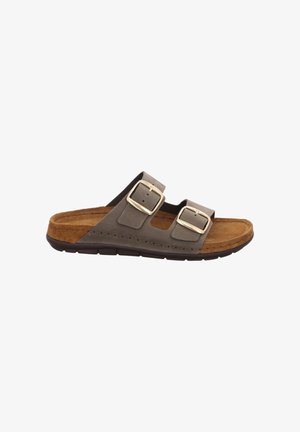 Brown slide sandal with two adjustable buckles, soft suede upper, cushioned footbed, and a rubber sole. Features a minimalist design.