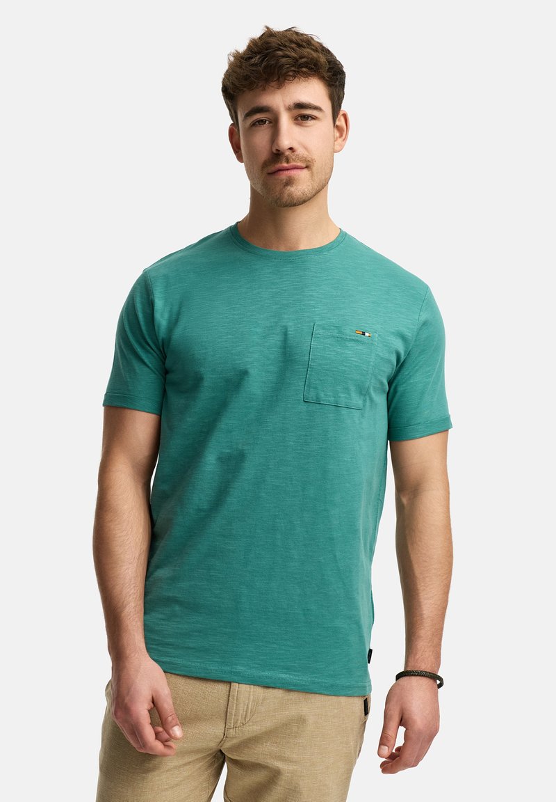 T-shirt verde acqua a girocollo in un morbido tessuto testurizzato con taschino sul petto; presenta un dettaglio del logo multicolore sulla tasca.