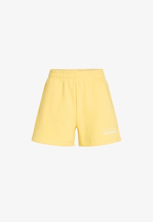 Žlté bavlnené šortky s elastickým pásom, bočnými vreckami a bielym textom "The Future Surf Society" na dolnej ľavej stehne.