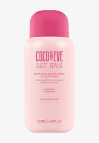 Rosa plastflaska med balsamet "Coco & Eve Sweet Repair", med fet text, rund kork och detaljer om ingredienser och användning.
