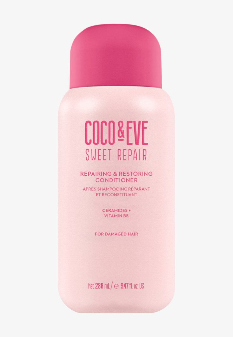 Rosa plastflaska med balsamet "Coco & Eve Sweet Repair", med fet text, rund kork och detaljer om ingredienser och användning.