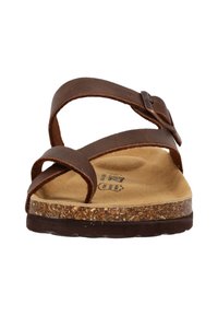 Ruske kožne sandale s križnim trakama, plutastom unutrašnjošću i teksturiranom gumom na potplatu. Kopča sa strane, ravni dizajn.