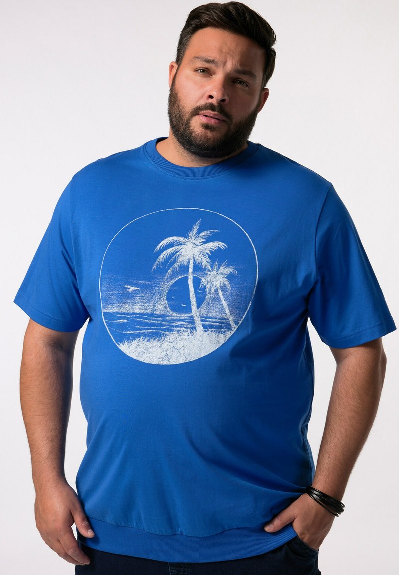 Modré bavlněné tričko s krátkým rukávem s kruhovým bílým potiskem palem a horizontu. Hladký materiál, volný střih.