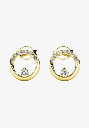 Orecchini a cerchio color oro con design circolare, decorati con una fila di cristalli trasparenti e una pietra centrale trasparente. Finitura in metallo liscia e lucida.