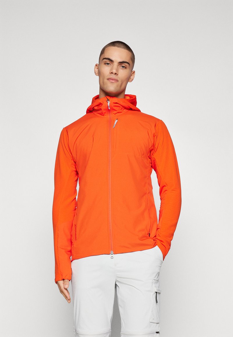 Men's zip-up jacket in bright orange, made of lightweight fabric. Features a hood, long sleeves, and a side zip pocket. Stretchy texture.