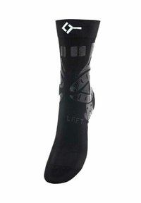 Zwarte sportsocken met een ademend ontwerp, textuurelementen en siliconen gripaccenten. Bevat de tekst "LINKER" afgedrukt op de zool.