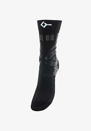 Calzino sportivo nero con un design traspirante, motivi testurizzati e dettagli in silicone antiscivolo. Presenta la scritta "SINISTRO" stampata sulla suola.