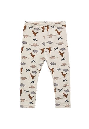 Leggings de algodón color crema con un estampado de dinosaurios en marrón, gris y negro. Cuentan con una cintura elástica para mayor comodidad.