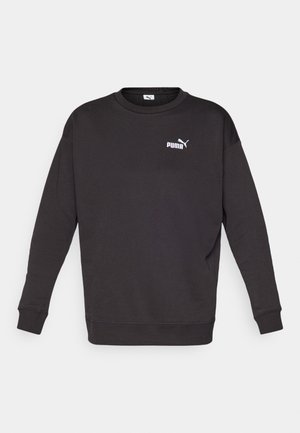 Sweatshirt noir à manches longues et col rond. Présente un petit logo Puma blanc sur la poitrine gauche. Texture de tissu douce.