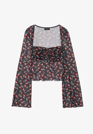 Bloemen nettop met lange, uitlopende mouwen. Zwarte basis met een rood en blauw bloemenpatroon, voorzien van een gerimpelde lijfje en golvende zoom.