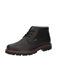 Bottines en cuir noir avec semelle cousue marron, lacets à l'avant et semelle en caoutchouc texturé, conçues pour une tenue décontractée masculine.