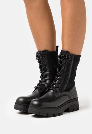 Calvin Klein Jeans CHUNKY COMBAT LACEUP ZIP - Botines con plataforma - black