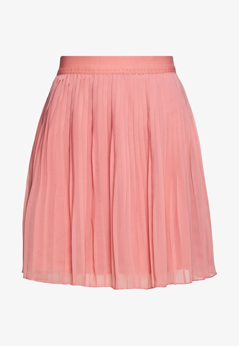 Jupe plissée rose clair avec une taille haute, longueur au genou, fabriquée en tissu léger et transparent.