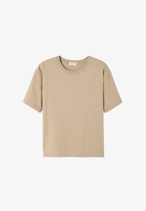 Short-sleeved, round-neck T-shirt in light beige, made from soft, textured fabric. Features a relaxed fit with stitched detailing.