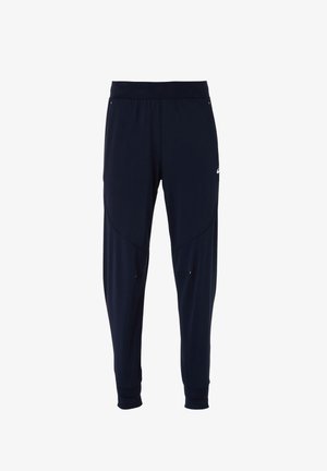 Marineblaue Sporthose mit einem eng anliegenden Taillenbund, schmal zulaufenden Beinen, dezenten Seitentaschen und einer glatten Stofftextur. Mit Logodetail.