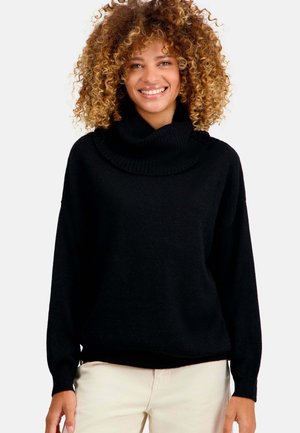 Pull à col roulé noir en mélange de laine doux, offrant une coupe ample, un col côtelé et des coutures d'épaule tombantes. Design classique.