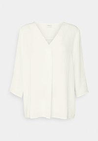 Blusa bianca a scollo a V con maniche a tre quarti, morbida al tatto, vestibilità rilassata e spacchi laterali. Presenta dettagli di cucitura minimi per un aspetto pulito.