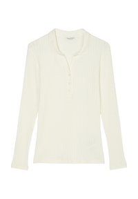 Polo a maniche lunghe in crema chiaro con una texture a coste. Presenta una chiusura con bottoni e un colletto morbido. Design semplice senza fantasie.