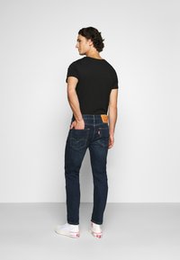 Levi's® 502™ TAPER HI-BALL - Calças de ganga de perna direita - med indigo