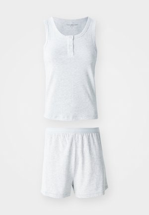 Light gray cotton tank top with a buttoned neckline, paired with matching shorts featuring an elastic waistband. Soft texture, relaxed fit.