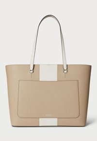 Beige leather tote with white accents, structured shape, long straps, front pocket, smooth texture, and embossed brand logo at the bottom.
