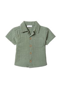 Camicetta a maniche corte con bottoni in morbido cotone texturizzato; colore verde salvia con bottoni di legno e una tasca sul lato sinistro del petto.
