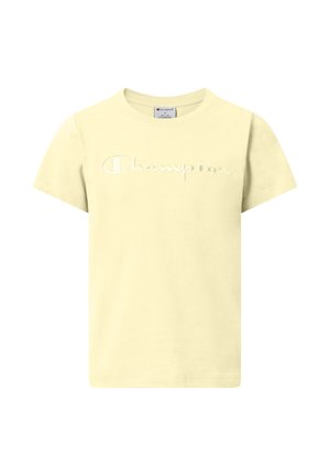 Jasnożółta koszulka z krótkim rękawem i okrągłym dekoltem, z wyhaftowanym na piersi logo „Champion” w pasującym, bladożółtym kolorze nici.