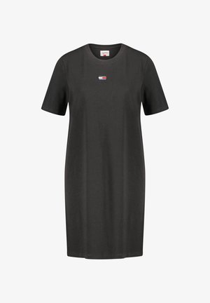 Czarna sukienka T-shirt z krótkim rękawem z małą prostokątną łatą z logo Tommy Jeans umieszczoną na środku klatki piersiowej.