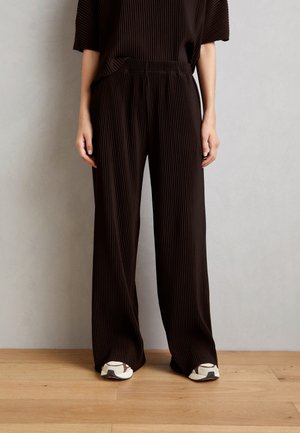 BYTRISSA - Trousers - black