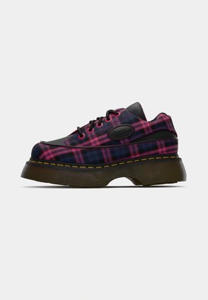 Textured black and pink plaid shoes with a chunky brown sole, featuring black accents and lace-up design. Rounded toe and defined stitching.