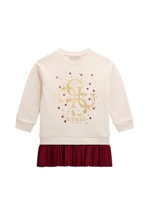 Robe crème à manches longues avec un logo pailleté doré et de petits cœurs rouges, avec une jupe plissée bordeaux attachée à l'ourlet.