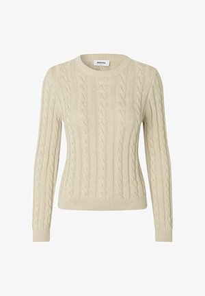 Maglione in lana lavorata a trecce color crema con maniche lunghe e bordi a costine su polsini, orlo e scollatura, con un ricamo sottile sul petto.