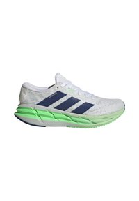 White athletic shoe with textured upper, navy stripes, and a green midsole. Features a rounded toe and distinct outsole tread pattern.