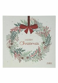 Adventtikalentteri, jossa on seppeleen muotoinen koriste, vihreitä ja punaisia lehtiä, männynkäpyjä ja punainen rusetti. Tekstinä lukee "Hyvää joulua."